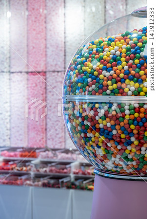 showcase of candy shop, transparent container with various sweets, marshmallow, jelly, chewy gums, rich sugar assortment showcase of candy shop, transparent container with various sweets, marshmallow, jelly, chewy gums, rich sugar assortment 141912333