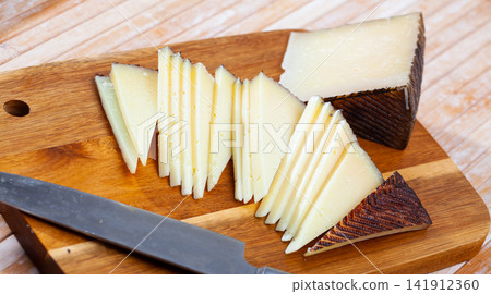 Sliced semi hard spanish sheep cheese Manchego, nobody Sliced semi hard spanish sheep cheese Manchego, nobody 141912360