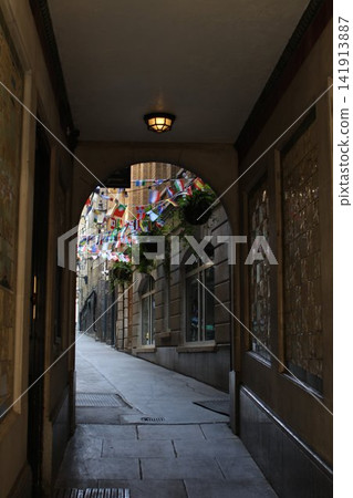 Historic Covered Passageway Decorated with International Flags Historic Covered Passageway Decorated with International Flags 141913887
