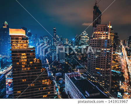 Bangkok city skyline and illuminated high-rise skyscraper buildings, Night cityscape of downtown financial district with modern urban towers of Thailand capital 141913967