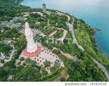 religious Lady Buddha monument at Linh Ung pagoda and buddhism temple in Danang, Asian religion and spirituality, Son Tra peninsula, Da Nang Vietnam, aerial drone view religious Lady Buddha monument at Linh Ung pagoda and buddhism temple in Danang, Asian religion and spirituality, Son Tra peninsula, Da Nang Vietnam, aerial drone view 141914130