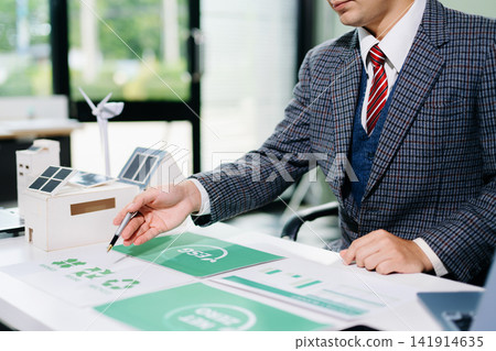 business team people planning and discussing on recycle reduce reuse policy symbol in office meeting room. Green business company and Solar Energy Environment city Concept. 141914635