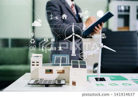 Young man hand holding green earth with NET ZERO representing carbon neutrality, renewable energy, clean technology, climate change, sustainability 141914637