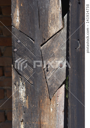 Old weathered wooden beam with traditional joinery closeup Old weathered wooden beam with traditional joinery closeup 141914738