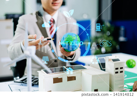 Business team working virtual modern smartphone to reduce CO2 emissions carbon footprint climate change to limit global warming.Sustainable development and green business concept. at office Business team working virtual modern smartphone to reduce CO2 emissions carbon footprint climate change to limit global warming.Sustainable development and green business concept. at office 141914812