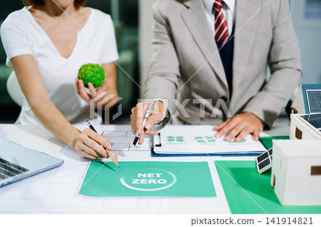 business team people planning and discussing on recycle reduce reuse policy symbol in office meeting room. Green business company and Solar Energy Environment city Concept. business team people planning and discussing on recycle reduce reuse policy symbol in office meeting room. Green business company and Solar Energy Environment city Concept. 141914821