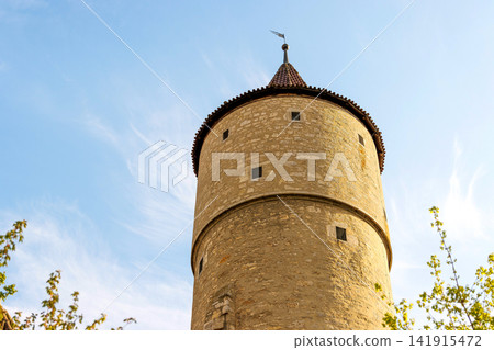Low-angle view of the historic city wall Cent Tower, Centturm in Ochsenfurt, Bavaria, Germany. Low-angle view of the historic city wall Cent Tower, Centturm in Ochsenfurt, Bavaria, Germany. 141915472