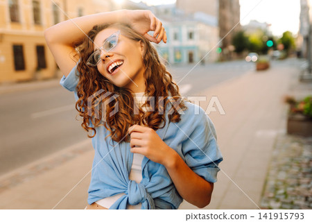 Young woman travels during student vacation holidays in street of European city. Fashion, lifestyle Young woman travels during student vacation holidays in street of European city. Fashion, lifestyle 141915793