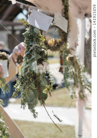 Dried flower garlands on display at a handmade market Dried flower garlands on display at a handmade market 141915859