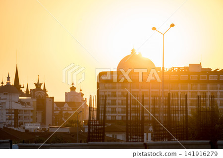 Antalya, Turkey, July 2026: Close-up view of a mosque minaret against the evening sky Antalya, Turkey, July 2026: Close-up view of a mosque minaret against the evening sky 141916279