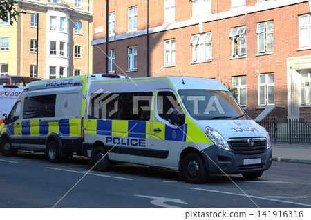 A British police car parked on a street in London. A British police car parked on a street in London. 141916316