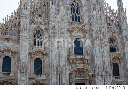 Duomo di Milano Cathedral View Framed by Archway Columns in Piazza del Duomo Milan Italy Duomo di Milano Cathedral View Framed by Archway Columns in Piazza del Duomo Milan Italy 141916643
