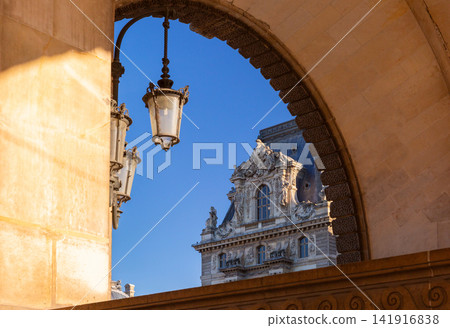 Historic Architecture Framed by a Monumental Stone Arch in Paris, France Historic Architecture Framed by a Monumental Stone Arch in Paris, France 141916838