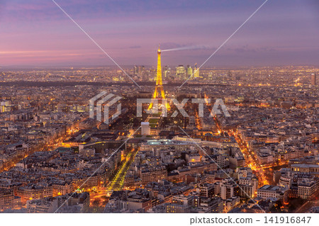 Panoramic View of Paris Cityscape at Sunset with Illuminated Streets Panoramic View of Paris Cityscape at Sunset with Illuminated Streets 141916847