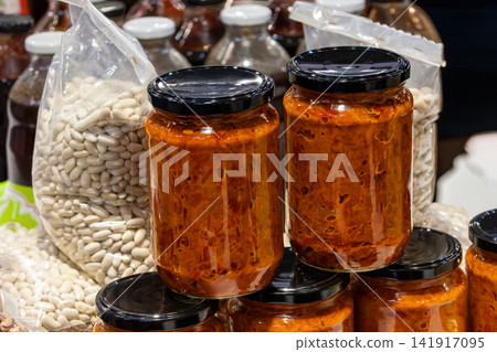 Ajvar spread in glass jars on market 141917095