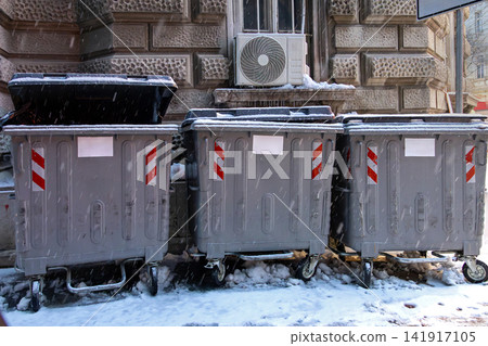Garbage containers in city street Garbage containers in city street 141917105