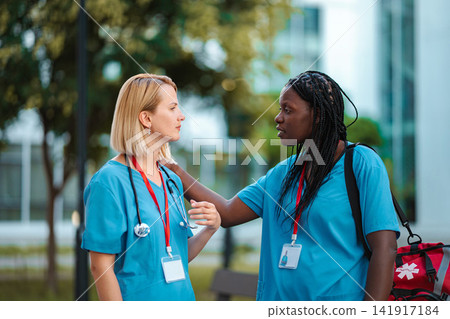Healthcare workers supporting each other during a difficult time Healthcare workers supporting each other during a difficult time 141917184