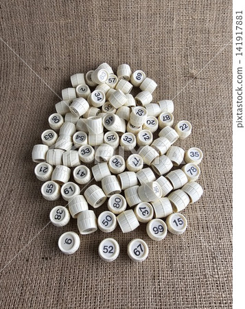 Vintage Soviet Lotto Numbered Barrels on Burlap Background 141917881