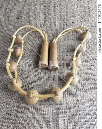 Coiled Vintage Wooden Massage Belt with Two Handles Coiled Vintage Wooden Massage Belt with Two Handles 141918498