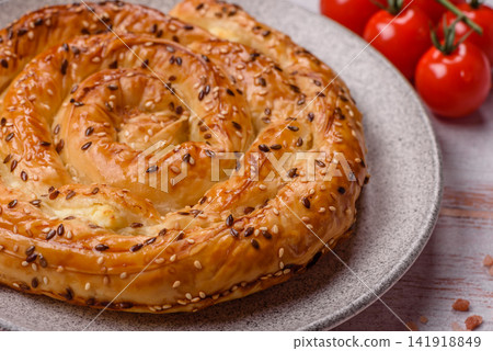 Greek cheese and sesame pie, a traditional Balkan dish. Balkan pie Greek cheese and sesame pie, a traditional Balkan dish. Balkan pie 141918849