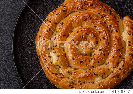 Greek cheese and sesame pie, a traditional Balkan dish. Balkan pie Greek cheese and sesame pie, a traditional Balkan dish. Balkan pie 141918867