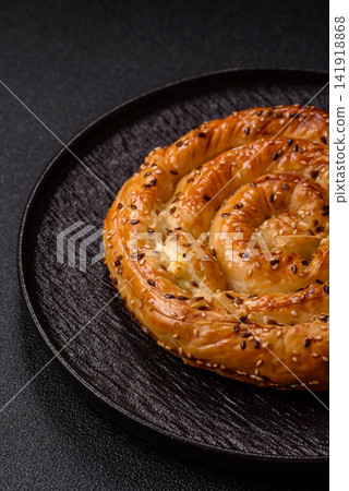 Greek cheese and sesame pie, a traditional Balkan dish. Balkan pie Greek cheese and sesame pie, a traditional Balkan dish. Balkan pie 141918868