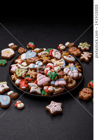 Gingerbread as a Christmas staple, sweets for the holiday interior. Gingerbread as a background Gingerbread as a Christmas staple, sweets for the holiday interior. Gingerbread as a background 141918888