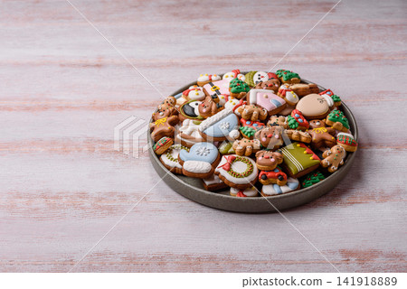 Gingerbread as a Christmas staple, sweets for the holiday interior. Gingerbread as a background Gingerbread as a Christmas staple, sweets for the holiday interior. Gingerbread as a background 141918889