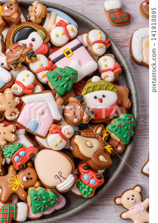 Gingerbread as a Christmas staple, sweets for the holiday interior. Gingerbread as a background Gingerbread as a Christmas staple, sweets for the holiday interior. Gingerbread as a background 141918895