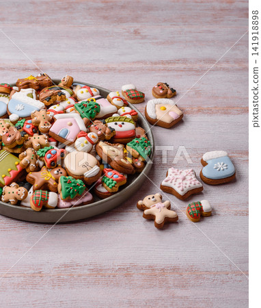 Gingerbread as a Christmas staple, sweets for the holiday interior. Gingerbread as a background Gingerbread as a Christmas staple, sweets for the holiday interior. Gingerbread as a background 141918898