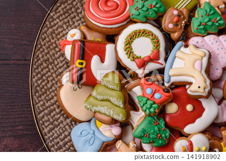Gingerbread as a Christmas staple, sweets for the holiday interior. Gingerbread as a background Gingerbread as a Christmas staple, sweets for the holiday interior. Gingerbread as a background 141918902