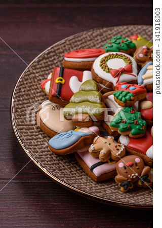Gingerbread as a Christmas staple, sweets for the holiday interior. Gingerbread as a background Gingerbread as a Christmas staple, sweets for the holiday interior. Gingerbread as a background 141918903