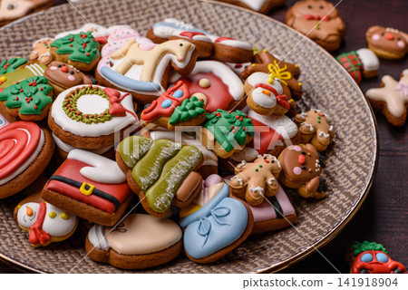 Gingerbread as a Christmas staple, sweets for the holiday interior. Gingerbread as a background Gingerbread as a Christmas staple, sweets for the holiday interior. Gingerbread as a background 141918904