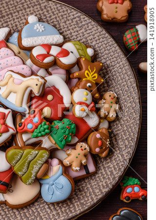 Gingerbread as a Christmas staple, sweets for the holiday interior. Gingerbread as a background Gingerbread as a Christmas staple, sweets for the holiday interior. Gingerbread as a background 141918905