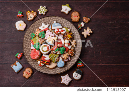 Gingerbread as a Christmas staple, sweets for the holiday interior. Gingerbread as a background Gingerbread as a Christmas staple, sweets for the holiday interior. Gingerbread as a background 141918907