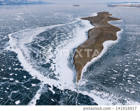 Aerial view of Dragon Point on Ogoi Island, where blue cracked ice is divided. Aerial view of Dragon Point on Ogoi Island, where blue cracked ice is divided. 141918917