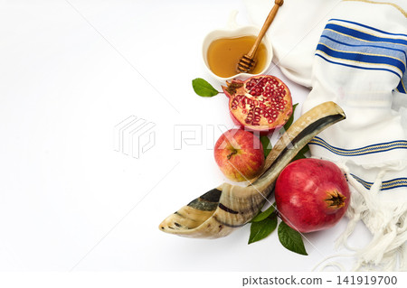 Rosh hashanah symbols with shofar, apples, pomegranates, and honey Rosh hashanah symbols with shofar, apples, pomegranates, and honey 141919700