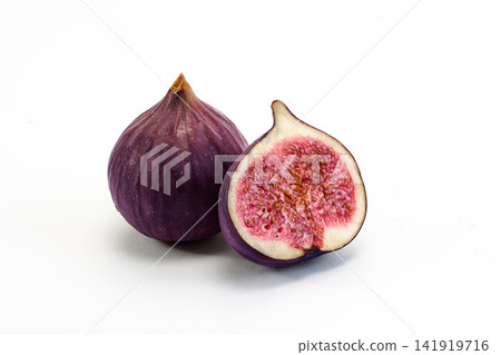 Purple fig fruit whole and cut showing seeds Purple fig fruit whole and cut showing seeds 141919716