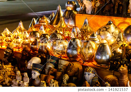 Electric luminous colorful mosaic lamps in oriental style as tourist souvenirs at night street market in Sharm El Sheikh, Egypt Electric luminous colorful mosaic lamps in oriental style as tourist souvenirs at night street market in Sharm El Sheikh, Egypt 141921537