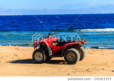 ATV quad bike for safari trips on a shore of the Red Sea in the Gulf of Aqaba. Dahab, Egypt ATV quad bike for safari trips on a shore of the Red Sea in the Gulf of Aqaba. Dahab, Egypt 141921553
