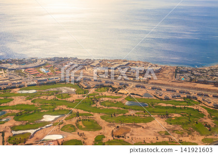Aerial view on the Red sea and Sharm El Sheikh city, Egypt. View from airplane Aerial view on the Red sea and Sharm El Sheikh city, Egypt. View from airplane 141921603