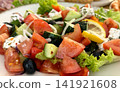 greek style salad with feta tomatoes cucumbers onions and lemon slice fresh food  141921608