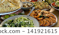 festive table with shrimp salads pancakes and appetizers on wooden table celebration meal  141921615