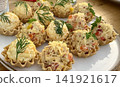 small basket servings of dill and grated cheese salad rustic food presentation  141921617