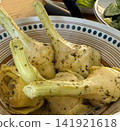 pickled artichokes on white plate with blue dots rustic food presentation  141921618