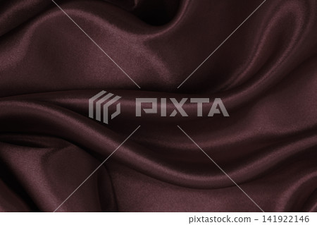 Smooth elegant brown silk or satin luxury cloth texture as abstract background. Luxurious background design wallpaper. In Sepia toned. Retro style 141922146
