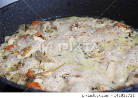 Cooking meat sauce in a frying pan close-up. Cooking meat sauce in a frying pan close-up. 141922721