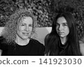 Mother and Daughter Portrait Sharing a Tender Family Moment 141923030