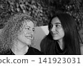 Mother and Daughter Portrait Sharing a Tender Family Moment 141923031