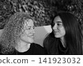Mother and Daughter Portrait Sharing a Tender Family Moment 141923032